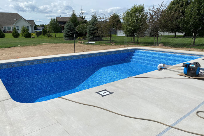 Inground pool vinyl liner replacement in progress